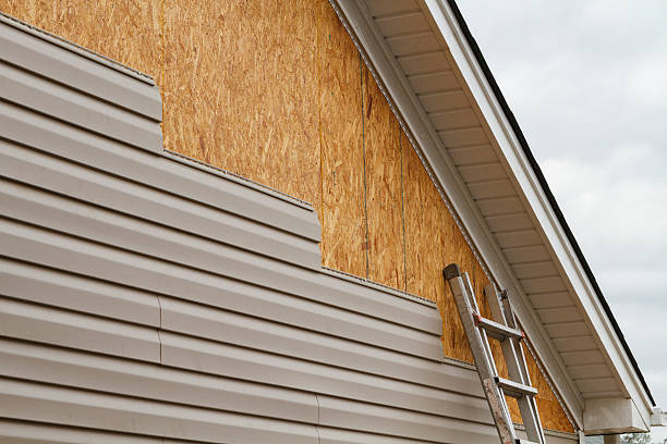 Professional Storm Damage Siding Repair technician working in Spring Grove, IL